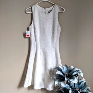 Never worn, quilted white dress.